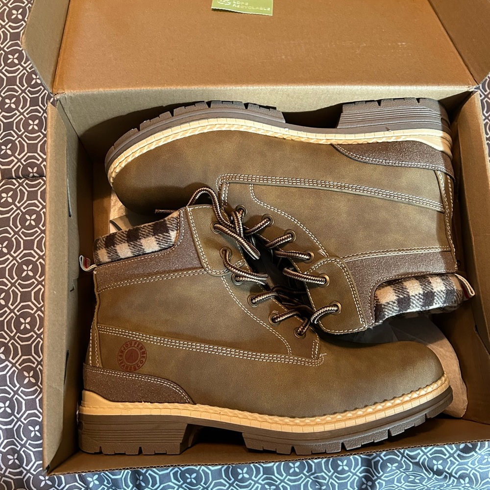 Cute brown boots with flannel edge. **never worn in perfect condition.